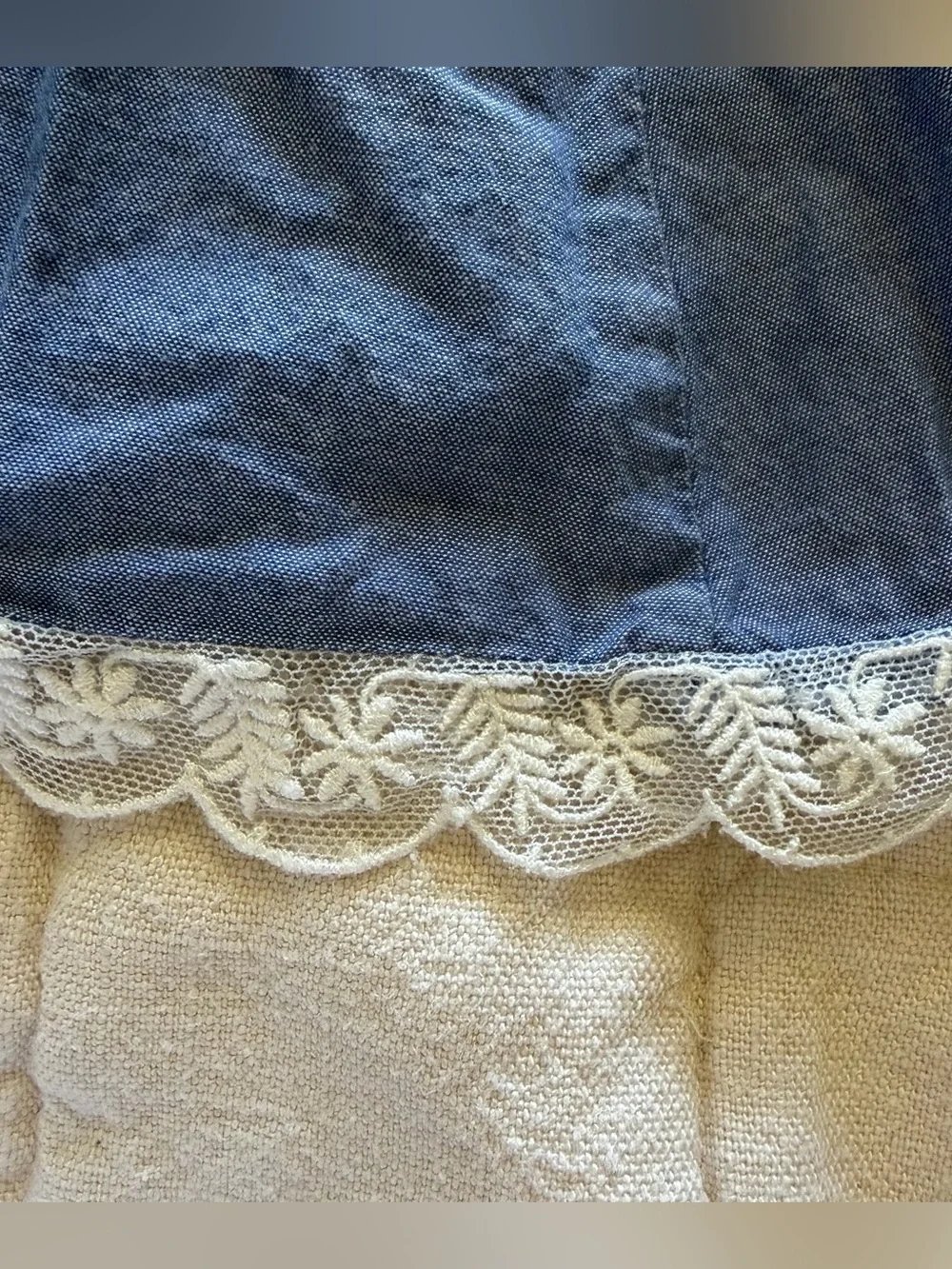 Girls Blue chambray dress with flower appliqué, flared sleeves, and floral lace